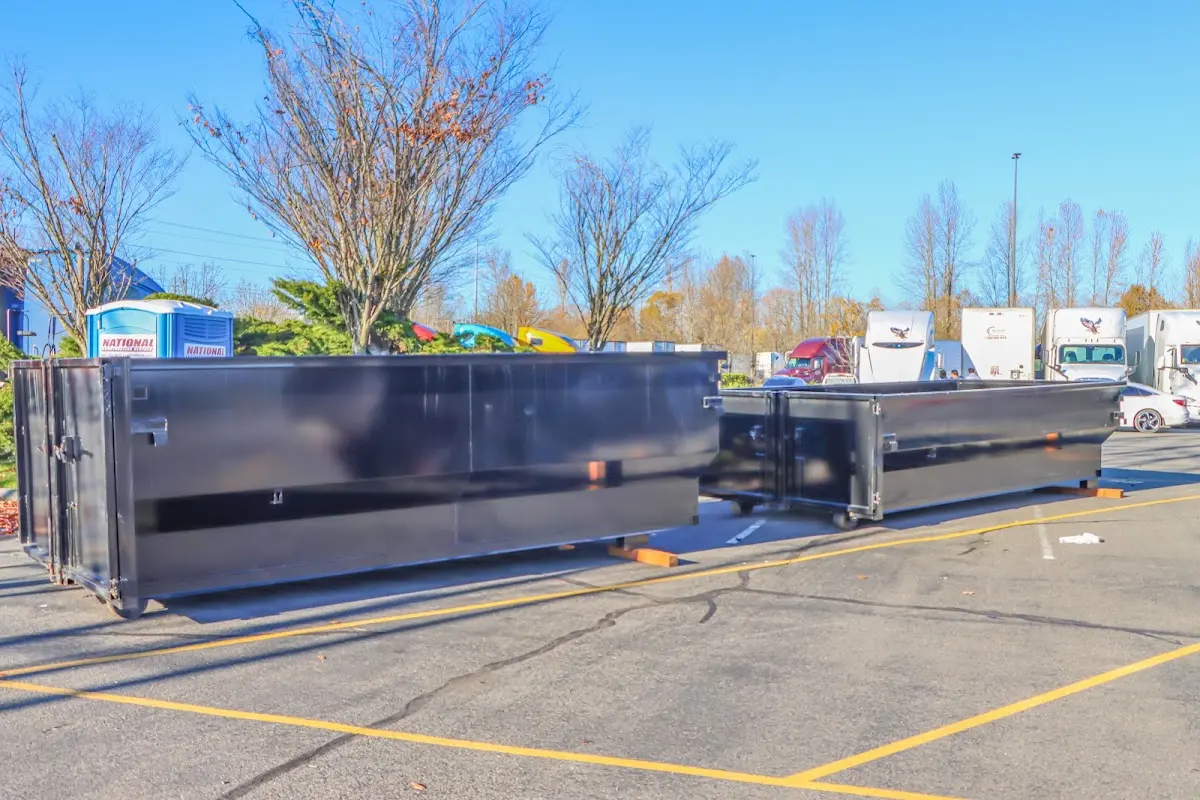 Professional dumpster rental service with roll-off container on residential driveway in Adairsville